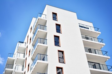 Modern apartment buildings on a sunny day with a blue sky. Facade of a modern apartment building