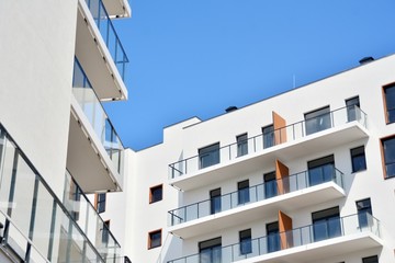 Modern apartment buildings on a sunny day with a blue sky. Facade of a modern apartment building