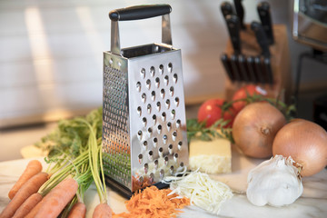 Cheese Grater and Vegetables