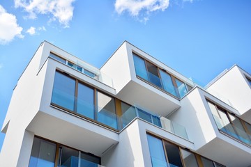Modern apartment buildings on a sunny day with a blue sky. Facade of a modern apartment building
