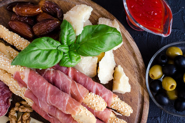 Wooden board with appetizers