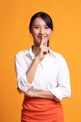 Asian girl smile show quite hand sign.