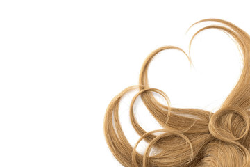 Brown hair isolated on white background. Heart shape