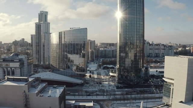 View of two modern glass skyscrapers in the city center in winter sunny day. Action. Urban landscape, Ekaterinburg, Urals, Russia