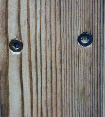 Wooden board with two screws