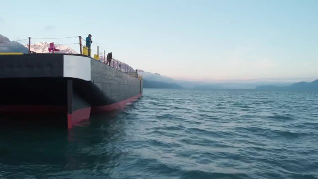 Alaskans subsistence fishing off a barge 