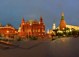 Fototapeta premium Night view of the historical museum and the Kremlin Arsenal Tower from Manezh Square. Russia, Moscow, May 2019
