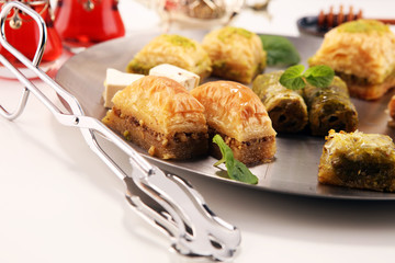 Middle eastern or arabic dishes. Turkish Dessert Baklava with pistachio on dishes