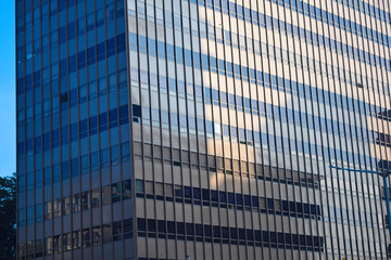 Fototapeta na wymiar modern glass and steel office buildings low angle view at Jakarta, Indonesia