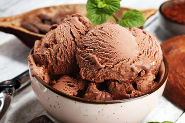 Chocolate coffee ice cream ball in a bowl. ice cream scoop