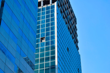Obraz premium modern glass and steel office buildings low angle view at Jakarta, Indonesia