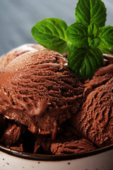 Chocolate coffee ice cream ball in a bowl. ice cream scoop