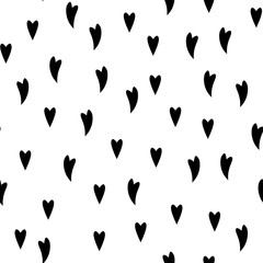 The seamless pattern with black hearts on a white background. Vector.