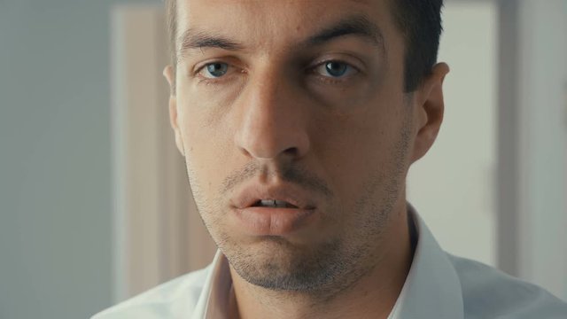 Businessman shocked and surprised. A man in surprise shoots glasses and looks at the camera in surprise.