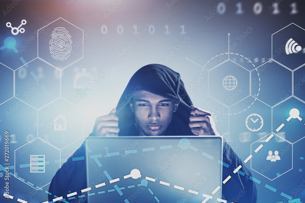 Poster hacker with laptop commiting online crime