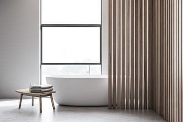 White and wooden bathroom interior with tub