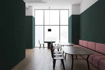 Green and white restaurant corner with sofa