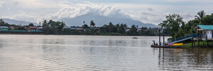 Naklejka premium Boat trip on the Sarawak river by sunset and night