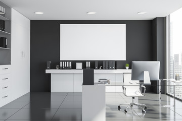 Gray and white manager office interior with poster