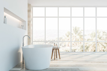 Fototapeta na wymiar Side view of white and stone bathroom with tub