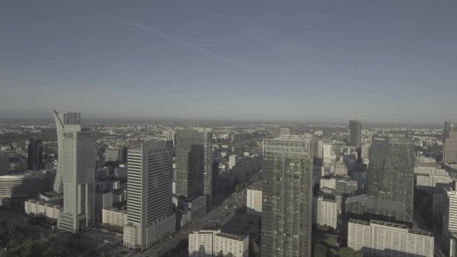 Aerial view of the financial district in Warsaw / Poland. Famous skyscrapers. Panorama of the city at the dawn of the sun. Shot from Drone 4K RAW