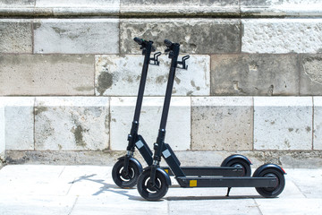 Modern сity transport - Two electric scooters is parked on the street of the city © Sodel Vladyslav