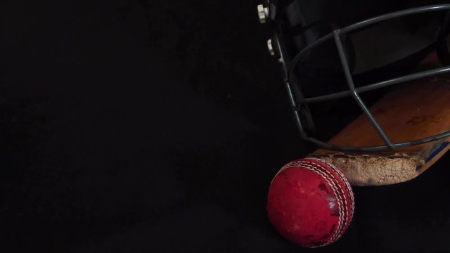Teapot is lifted alongside a cricket bat, ball and helmet.