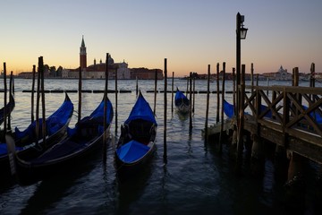 Gondole Stazio Danieliin on sunrise, with Church of San Giorgio Maggiore on the background. Venice, Italy