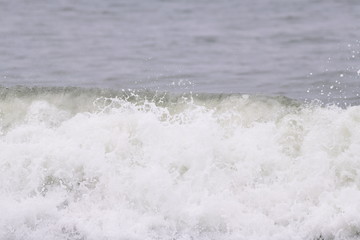 Ocean wave crashing on the beach