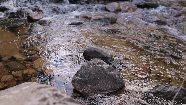 Tilt up shoot of beautiful waterfall of a river inside the seven brothers forest. Sette fratelli. Cagliari, Sardina, Italy
