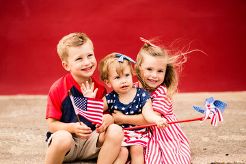 Cute Kids holding mini American flags
