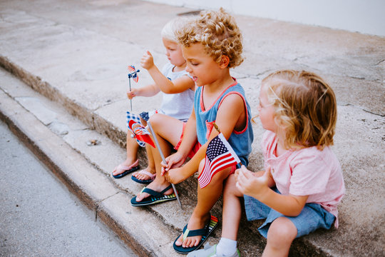 Cute American Kids watching Fourth of July Parade