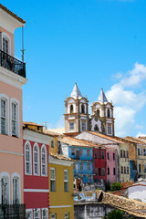 Colorful historic district of Pelourinho with cathedral on the background. The historic center of Salvador, Bahia, Brazil. Historic neighborhood famous attraction for tourist sightseeing. 