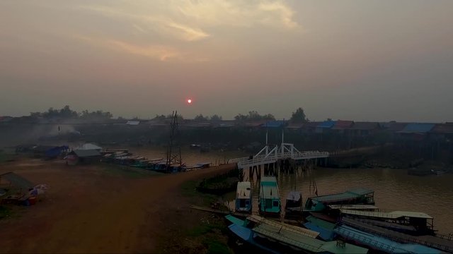 Aerial view of mekong river a fisher men village and a pile of boats on the river.