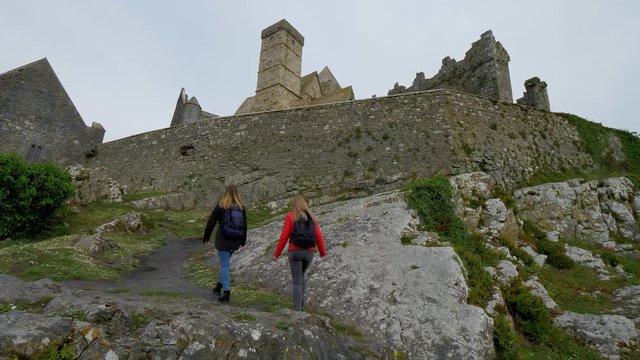 Two girls on their journey in Ireland visit the famous Rock of Cashel - travel photography
