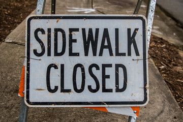Sidewalk Closed Sign Fills Frame
