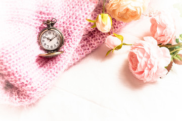 Old pocket watch with rose on sweaters In the vintage style tone 