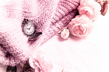 Old pocket watch with rose on sweaters In the vintage style tone 