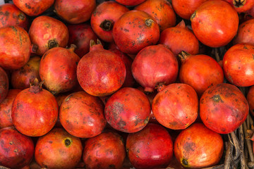 Fototapeta na wymiar Close-up of box with many Italian pomegranates in fair