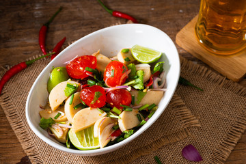 Spicy Salted egg yolk salad in white bowl