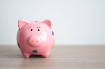 Pink ceramic piggy bank on white background, saving money concept