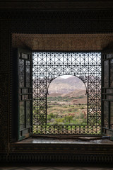 Beautiful window looking out to a Moroccan village in the distance