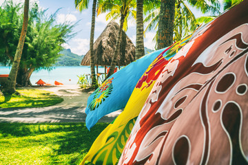 Tahiti vacation background saron pareo tahitian skirts flowing in the wind at beach resort souvenir...