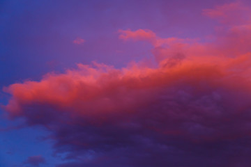Fototapeta na wymiar Beautiful colorful dramatic sky at sunset. Cumulus clouds in the evening. Bright blue lilac orange background.