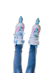 Legs in jeans and roller skates isolated on white background.