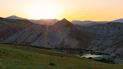 Obraz premium Sunset in the mountains, landscape with lake