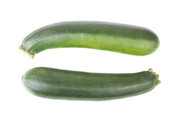 Two whole green zucchini isolated on white background