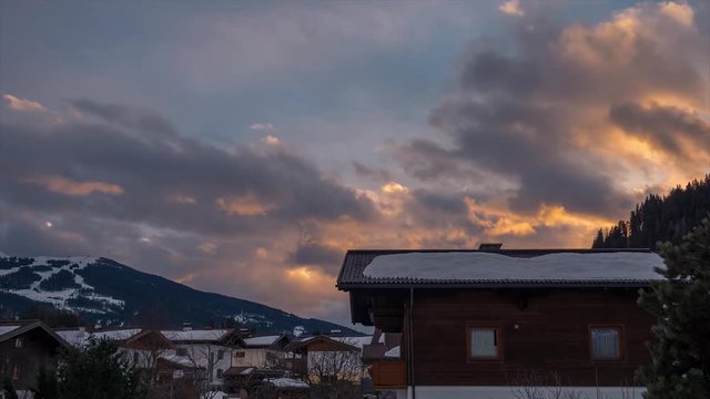 European Alps Snow Village Mountain Sunset Clouds Time Lapse to Night  