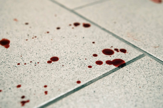 Conceptual image with blood on it resting on tiles on floor Stock Photo |  Adobe Stock
