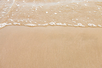 soft wave of the sea on the sandy beach.